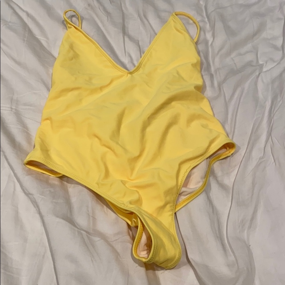 Bright yellow one piece bathing suit